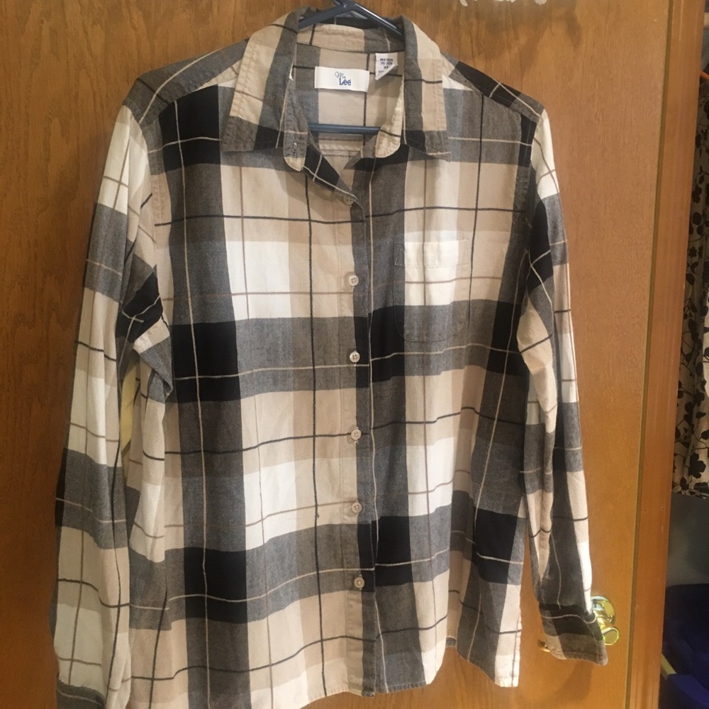 Button up top. Tan and black plaid.